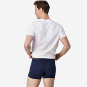 Back view of man wearing navy blue boxer brief.