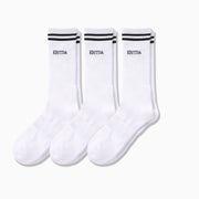 Three pairs of white crew socks against light grey background. Socks have back stripes and word "EBITA" printed on in small font under the stripes.