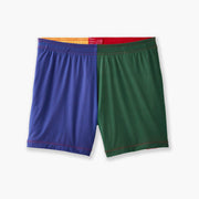 Close up shot of multi colored mesh "fun short" on a light grey background. Front colors are blue and green.