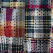 close up detail shot of Madras print lounge shorts.