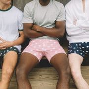 Close up shot of 3 men all wearing slim fit boxers in various colors with white dots on them.