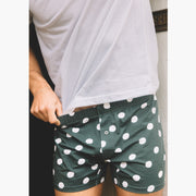 Close up shot of man wearing green slim fit boxers with white dots.