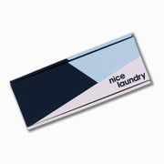 Monogram gift box with navy blue, light blue, white design.