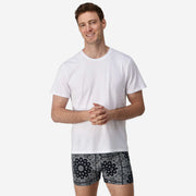 Front view of man wearing black bandana slim fit boxers & white t-shirt.