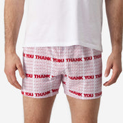 Close up front view of man wearing red & white printed "thank you" slim fit boxers & white t-shirt.