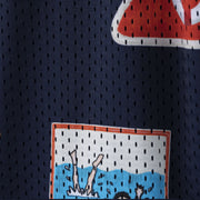 Close up detail shot of blue 'Scout' mesh lounge short with various patch designs printed on.
