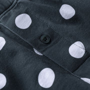 Close up detail shot of green slim fit boxer with white and drawn dots printed.