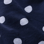 Close up detail shot of navy blue slim fit boxer with white hand drawn dots printed on.