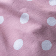 Close up detail shot of pink slim fit boxers with white hand drawn dots printed on.